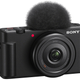 The Sony ZV-1F camera with a red LED light on the front indicating it's actively recording video.